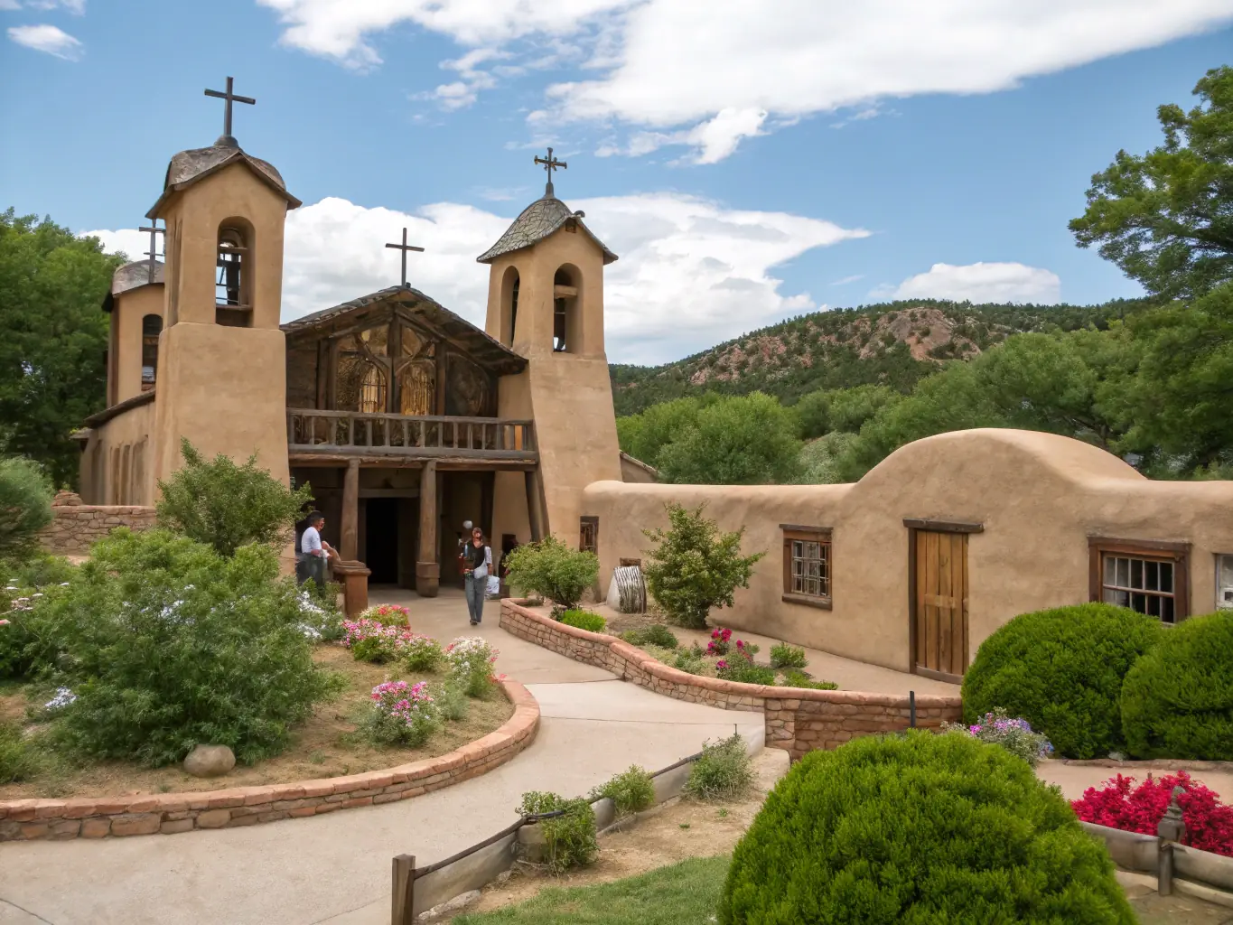 A scenic view of the Sanctuario de Chimayo, a historic church with adobe architecture and a peaceful atmosphere.